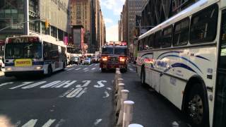 FDNY ENGINE 34 RESPONDING TO EMS CALL ON 8TH AVE. IN HELL'S KITCHEN, MANHATTAN IN NEW YORK CITY. Profile