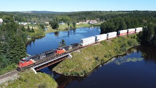 Celebrity Awesome 4K Aerial View! Short and Fast Stack Train CN 123 Passing Palmers Pond - Dorchester, NB Wealth