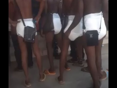 Nigerian Men Seen In Baby Pampers On A Queue At Lagos ATM Stand