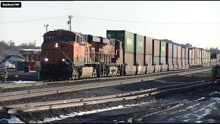 Sunset reflections on BNSF stack train crawling out of Glendive with the CP 8958 as DPU.