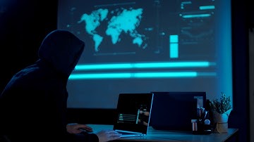 A Hacker With The Laptop in a Dark Room - Free Stock Video - (1080p)