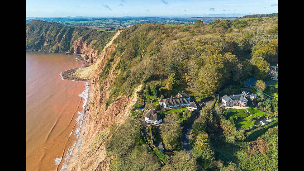 Homes perilously close to the cliff edge after recent rockfalls on the ...