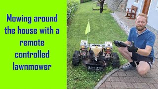 Mowing around the house with a remote controlled lawnmower - Full video