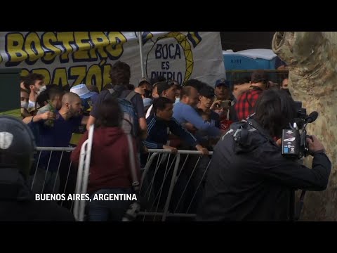Maradona fans try to rush building to see coffin