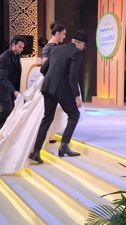 Madhuri Dixit goes up on stage to receive her award from Ghazal and Varun Alagh.