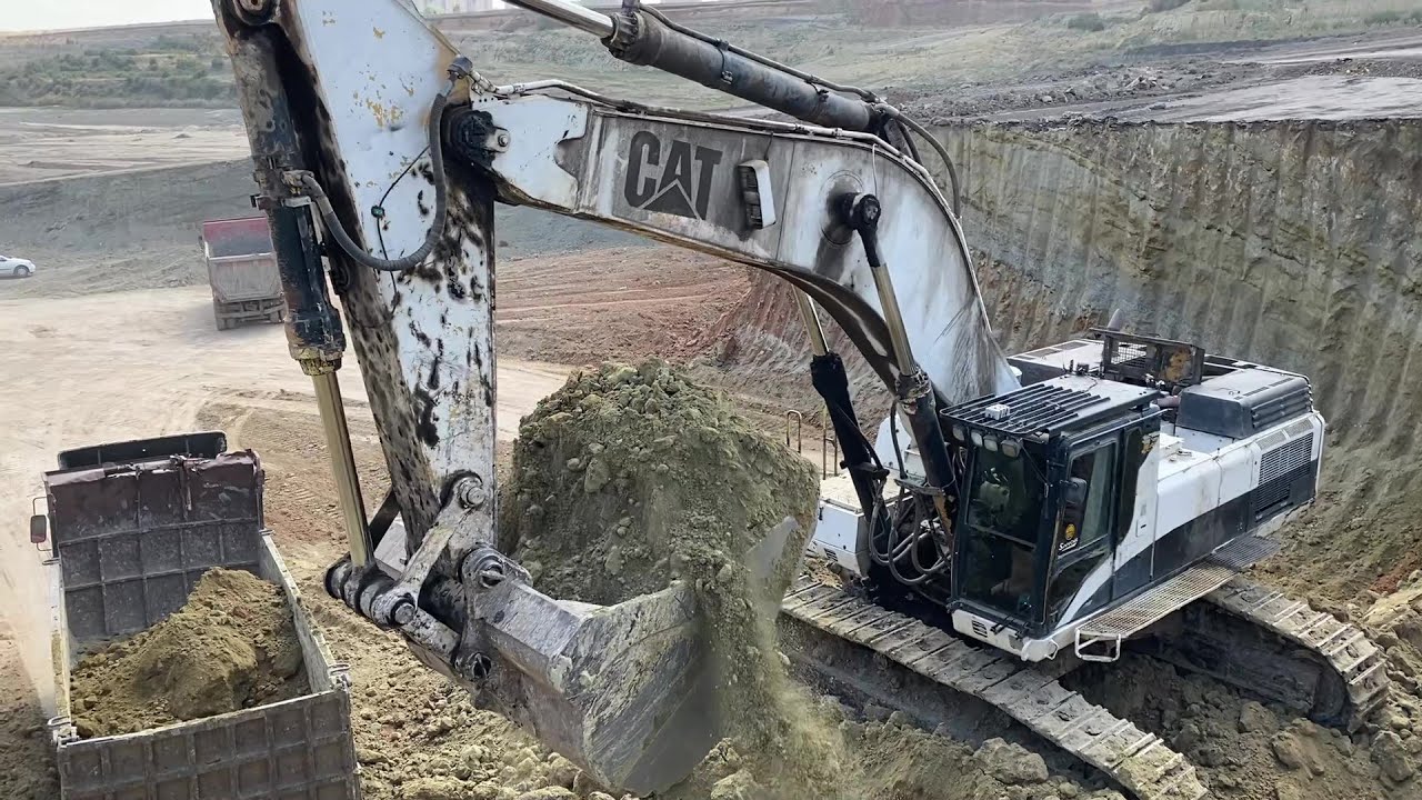 Caterpillar 375 Excavator Loading Mercedes And MAN Trucks - YouTube