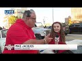 Mini marshal talks leading UW-Madison homecoming parade