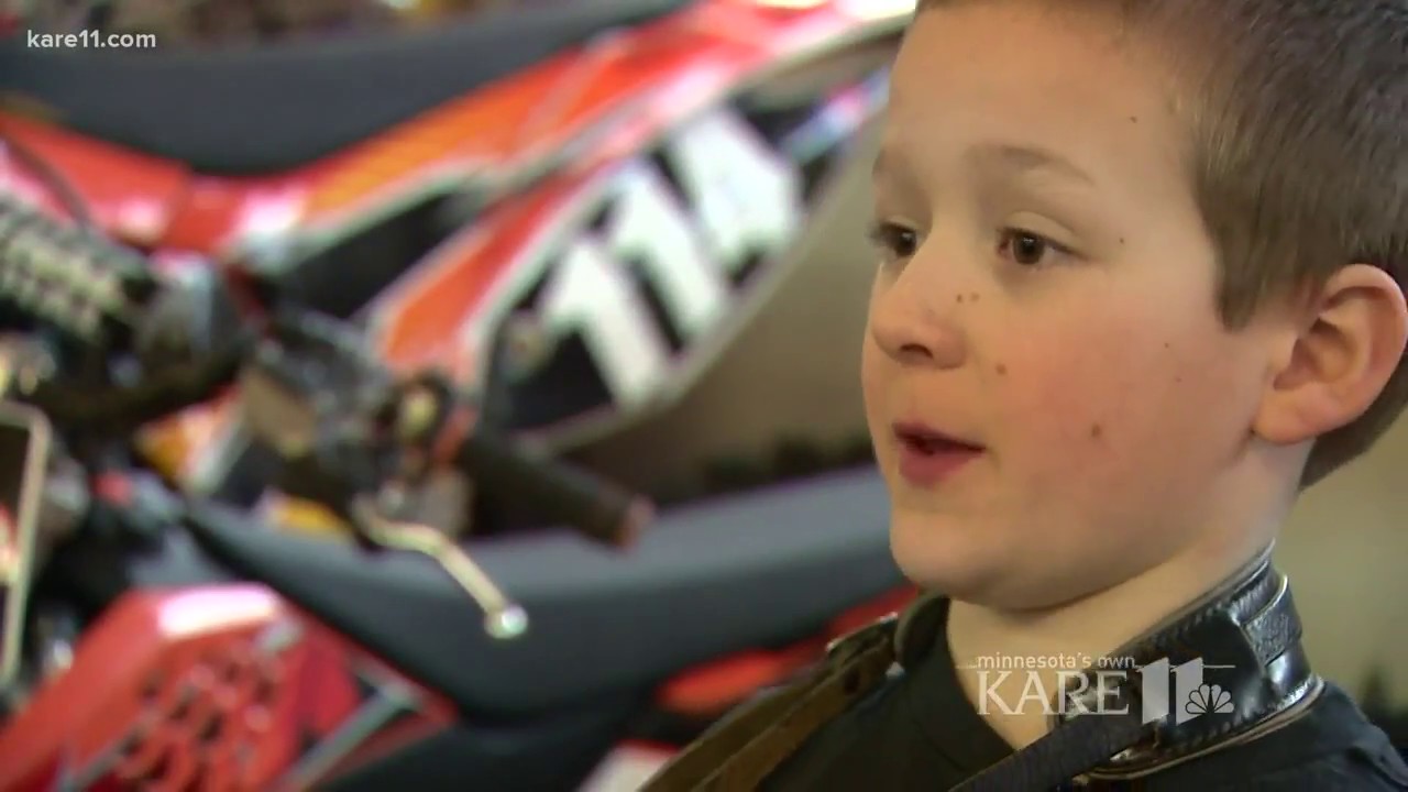 Young boy rocks concertina and lederhosen