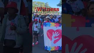 Children, parents march for autism awareness with songs of hope