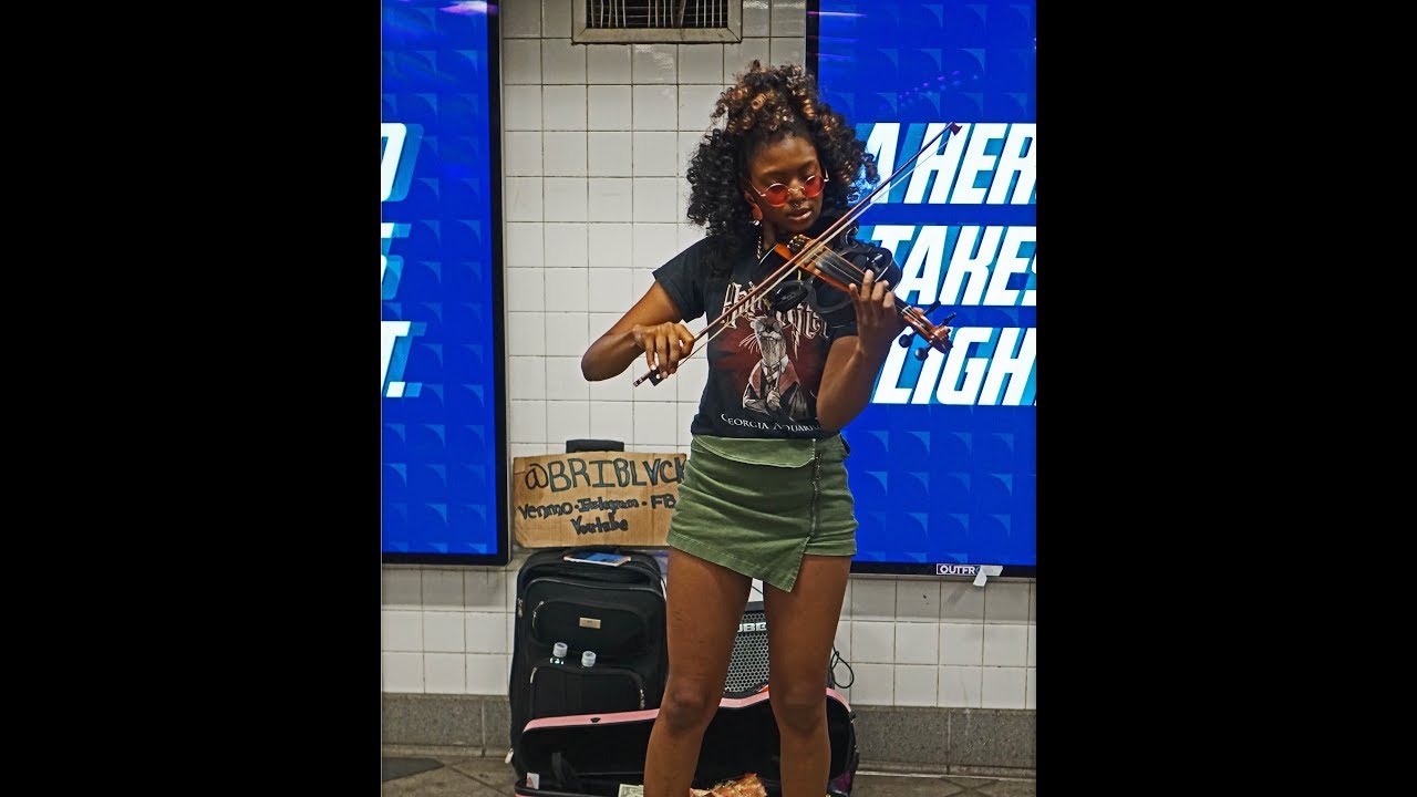 Beautiful Musician Playing in the Subway