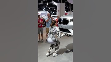 At the 2025 Tech Expo, a girl demonstrates the power of a wearable robotic exoskeleton.#tech #robot
