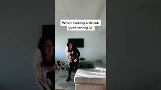 Woman and daughter do TikTok dance then they chest bump and girl falls off couch