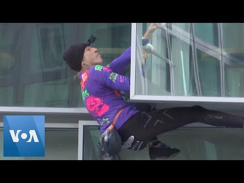 Climber Scales Paris Building in Climate Protest