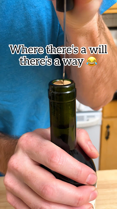 When there's no cork screw use a knife with a fork to open a wine bottle!