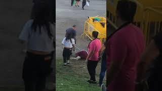 Little girl rides skateboard down hill and crashes into woman