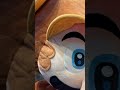 Winning a big Mario plush at the arcade