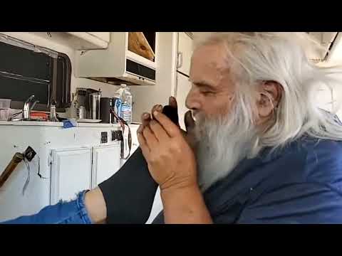 santa andy does a sniff test on vegan patriot's foot