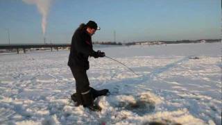 Ice Fishing For Pike At Sundom Bridge, Vaasa, Finland