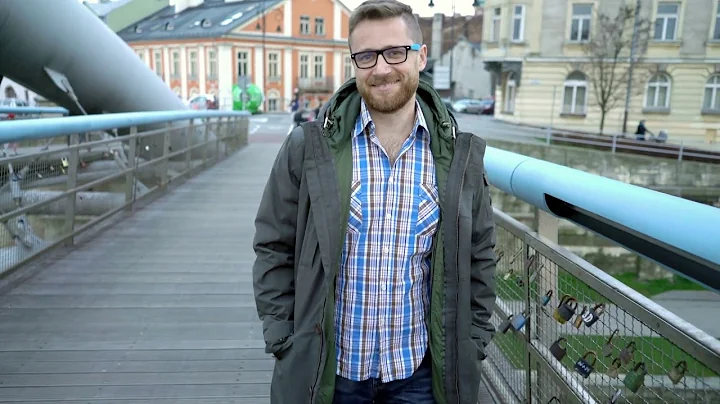 handsome man in jacket smiling to the camera while...