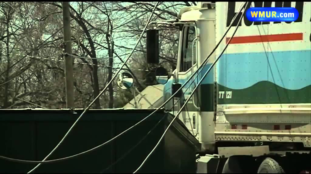 Truck brings down power lines - YouTube