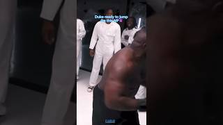 Duke Dennis punches big black male?