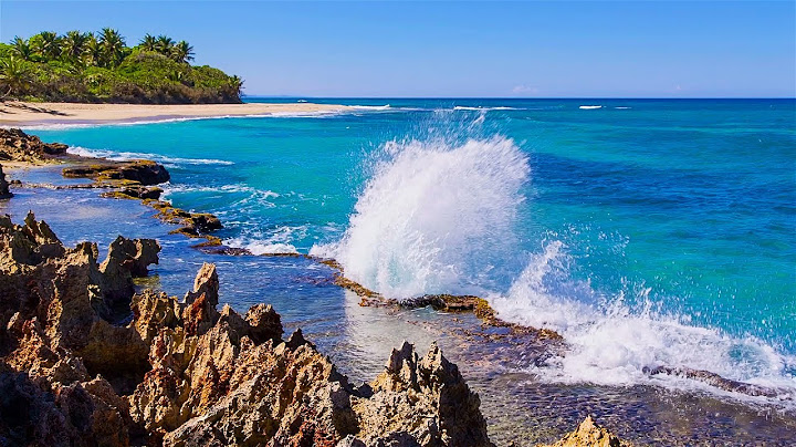 Splashing Waves All Day on Playa Encuentro - Refreshing and Relaxing on a Hot Summer Beach