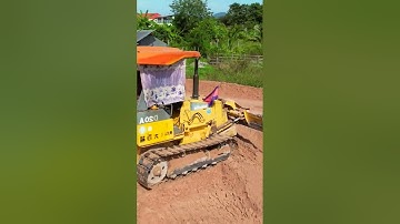 🛣️ Building the future one load at a time. Mini Dozer on duty for soil dumping.