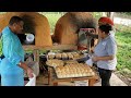 Getting the christmas bread  beausejour indigenous bakery  dirt oven