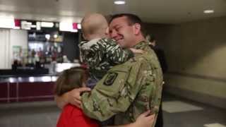 Soldier meets newborn, reunites with family