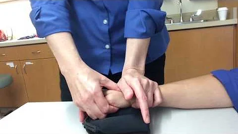Anterior glide of trapezoid on scaphoid to enhance midcarpal ulnar flexion