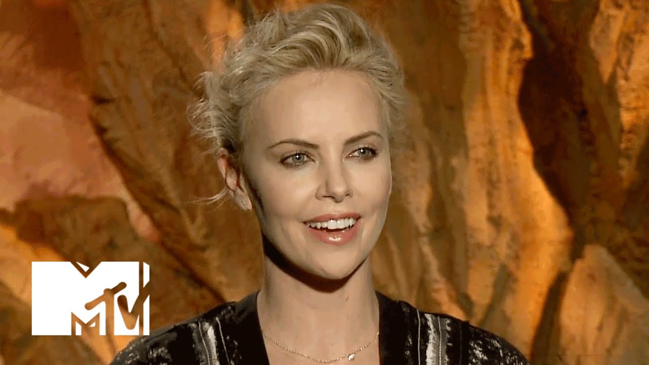Charlize Theron Reflects On What Advice She’d Give To Her Younger Self
