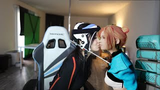 Miko and her technician share a kiss together.
