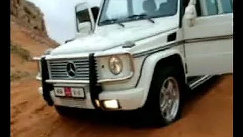 Beautiful white Mercedes G55 Kompressor in the arabian desert