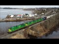 Awesome 4k aerial view long nbsr stack train 121 passing south bay departing west saint john nb