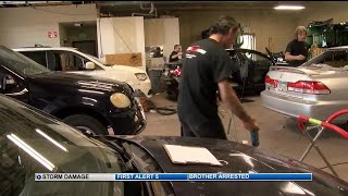 Shopping center accommodating cars needing hail-damage repairs