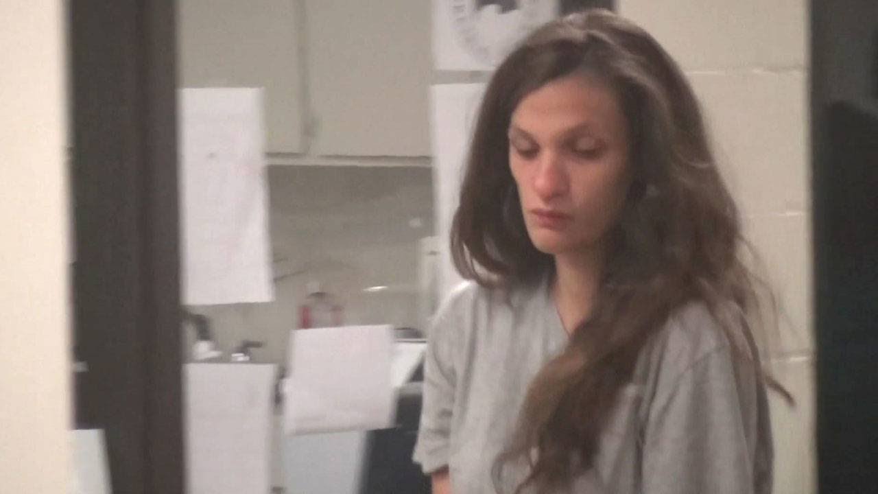 Woman accused of leaving newborn in flower bed appears in court - YouTube