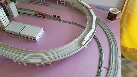 Kato N-scale layout - more buildings, more trains