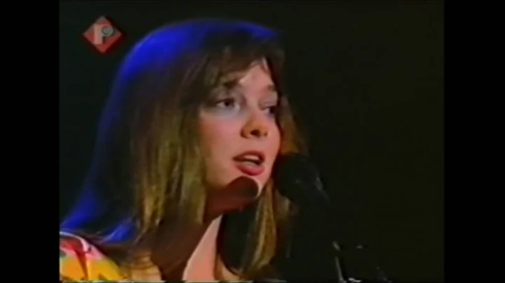 Nanci Griffith - There's A Light Beyond These Wood...