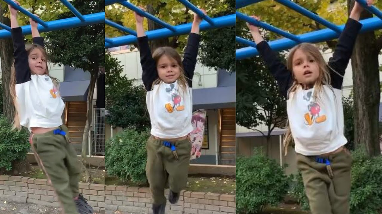 Mini Tarzan! Kourtney' son Regin climbing the monkey bars with complete