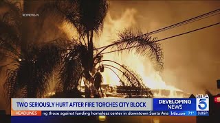 2 seriously hurt after fire torches city block in South Los Angeles