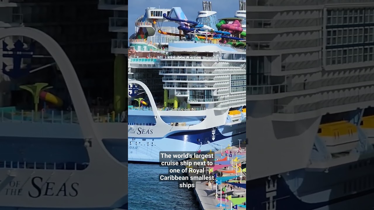 World's largest cruise ship docked next to older small ship