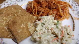 Spaghetti with coleslaw  Dutch koosla, “cabbage salad.” and garlic bread...