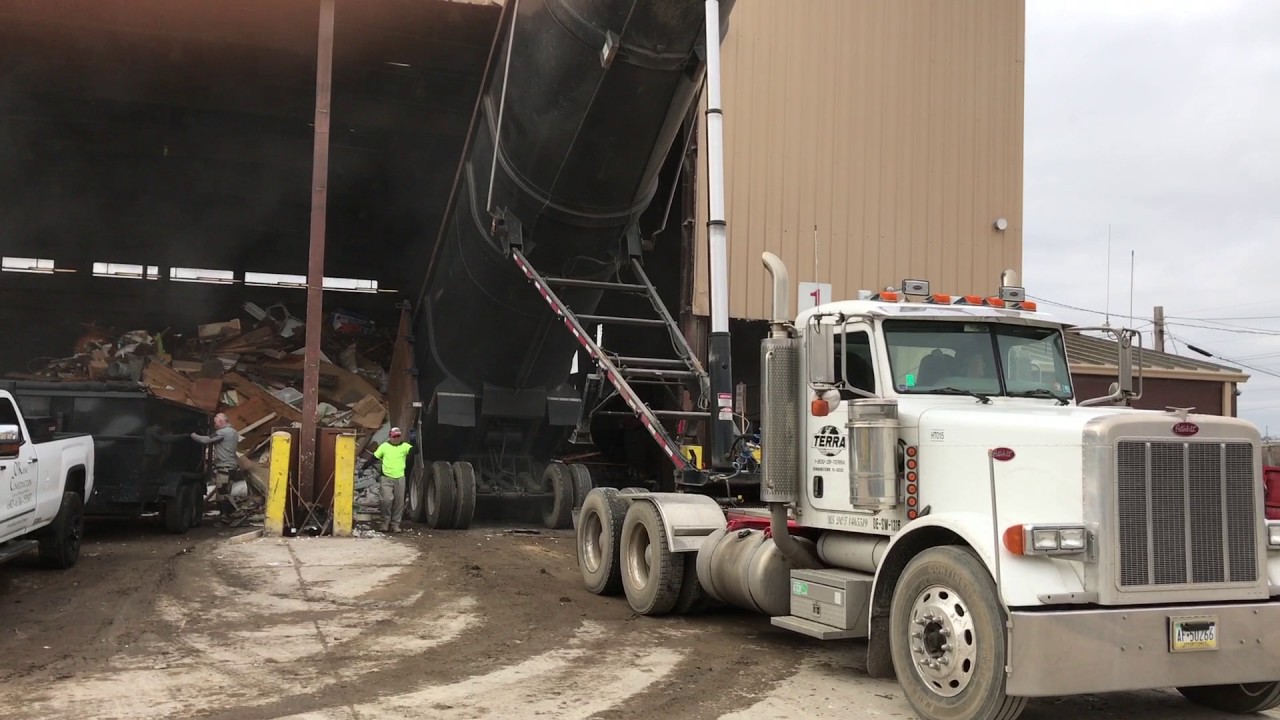 AWESOME 100 Yard Demolition Dump Truck dumping at Transfer station from