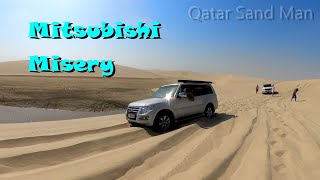 Winch Recovery of a Mitsubishi Pajero in sand dunes at the Inland Sea area of the Qatar Desert.