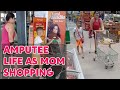 Amputee woman adaptive crutches user life activities | shopping timeout