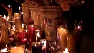 Candle vigil, "we'll never forget" sign near Ground Zero