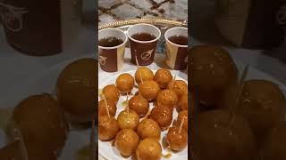 Enjoying Sweet Balls With Arabic Tea
