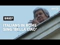 Italians in Rome sing 