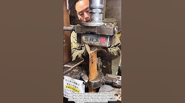 Industrial Axe-Fitting Machine in Action