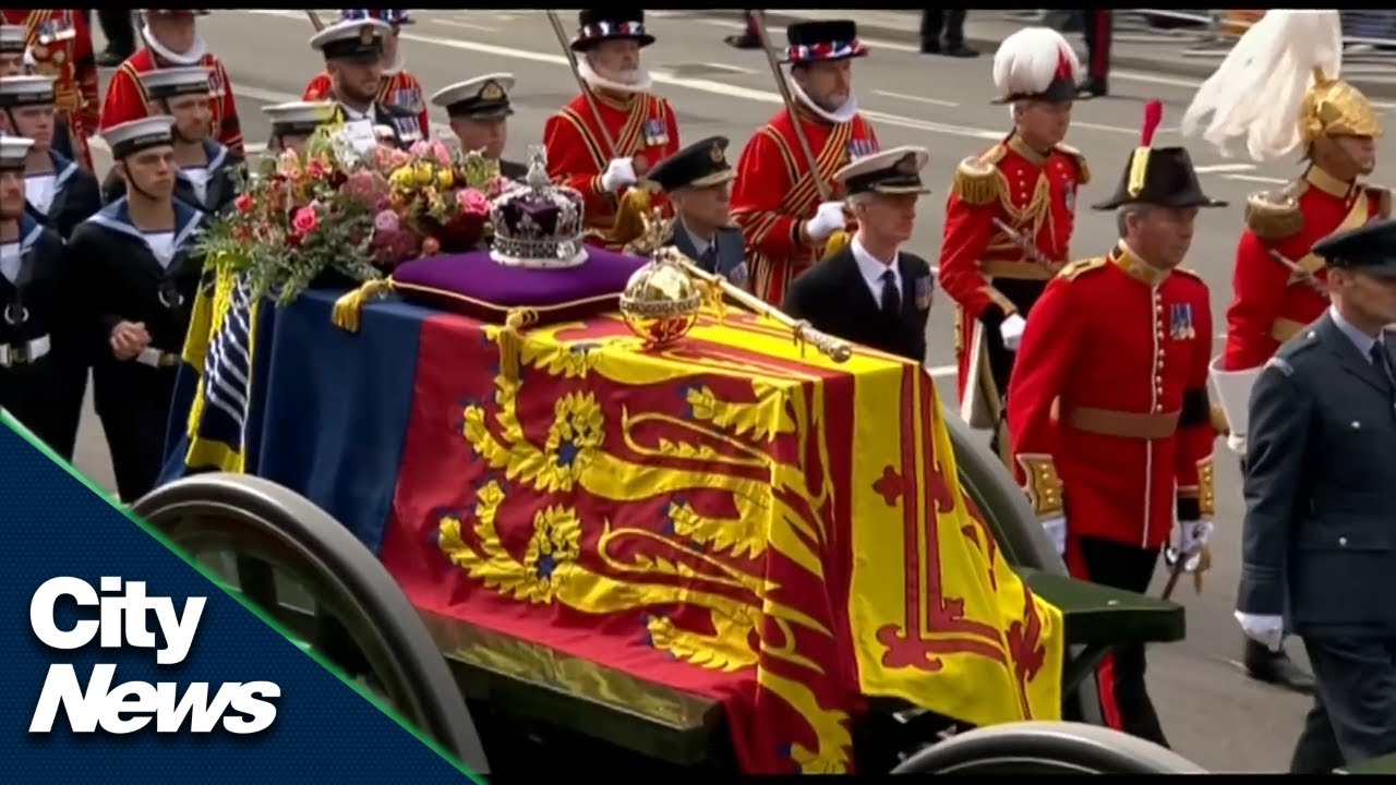 Queen's coffin heads through the streets of London following funeral